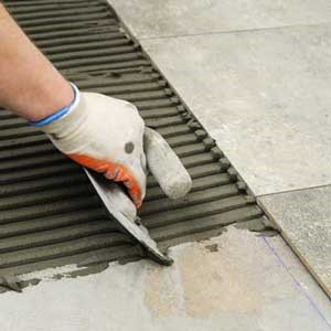 Man laying tiles